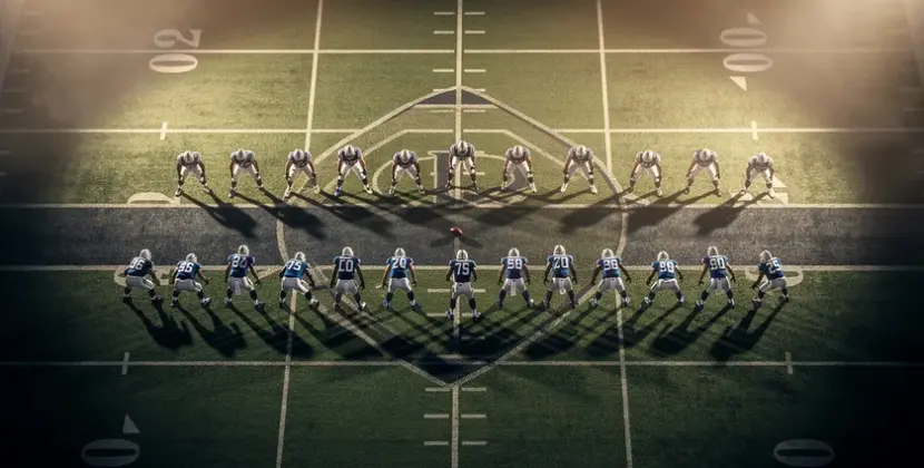NFL team helmets arranged around a Fantasy Football draft board showing 2026 salary cap figures