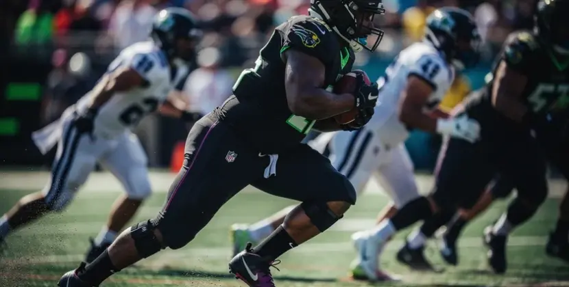 Josh Jacobs in Green Bay Packers uniform carrying the ball during an NFL regular season game