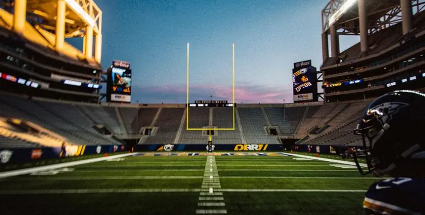 Nick Bosa in San Francisco 49ers uniform rushing the passer during an NFL game in 2025