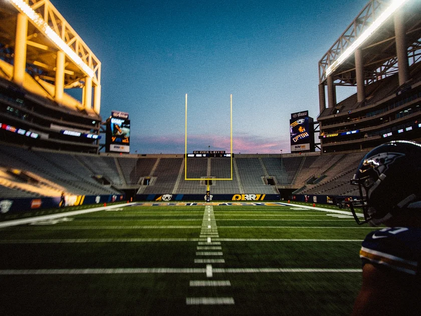 Nick Bosa in San Francisco 49ers uniform rushing the passer during an NFL game in 2025